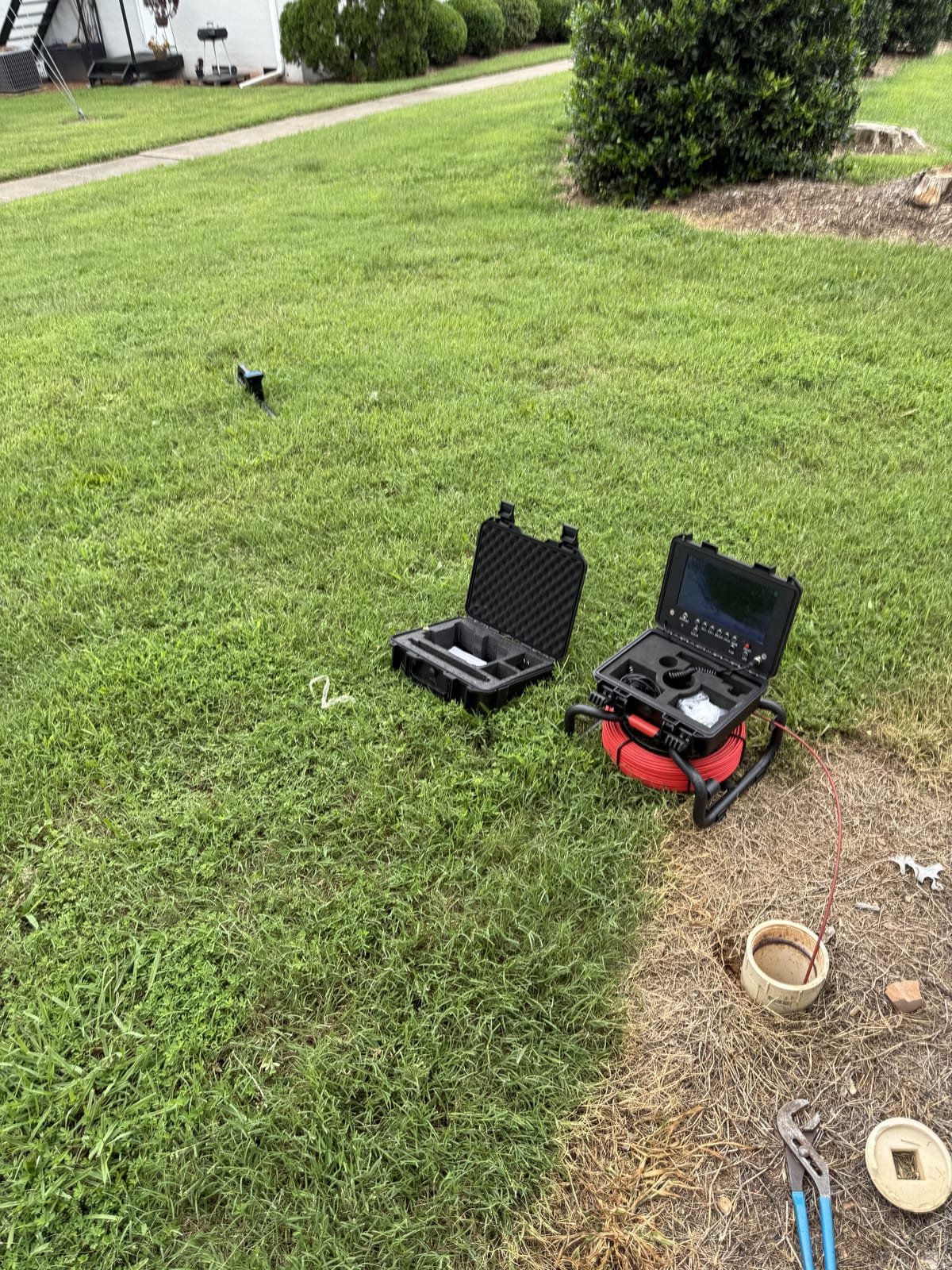 Drain inspection camera equipment set up for a sewer line inspection