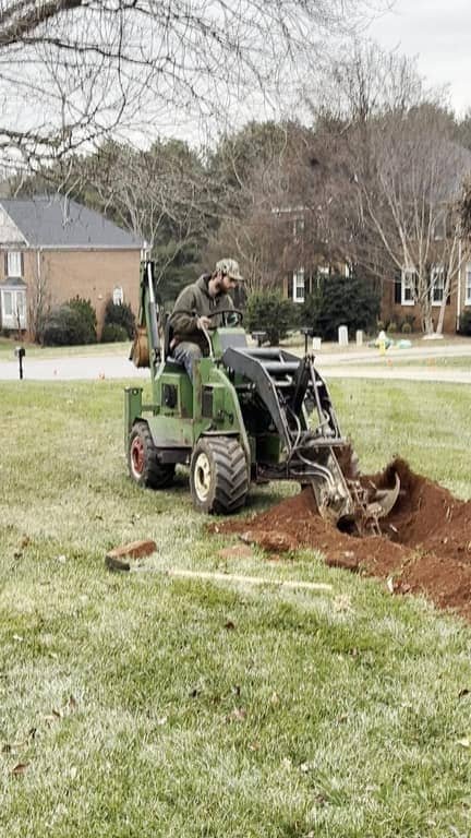 Trenching machine digging a trench for a new water service line